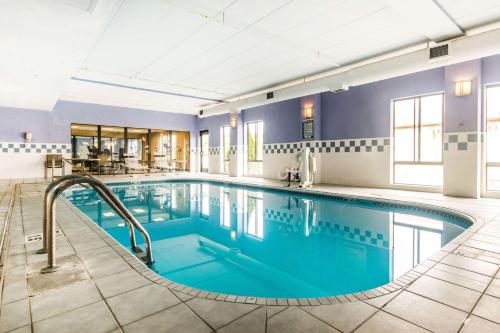 a pool in a hotel room with blue water at Quality Inn & Suites Lawrenceburg in Lawrenceburg