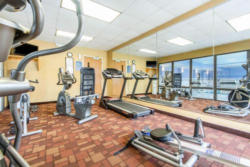 a gym with treadmills and elliptical machines at Quality Inn & Suites Lawrenceburg in Lawrenceburg