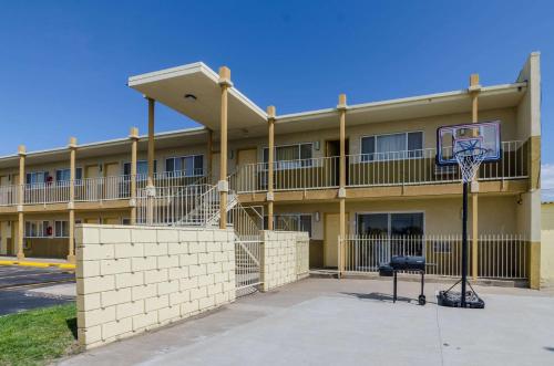 a basketball hoop in front of a building at Executive Inn Dodge City, KS in Dodge City