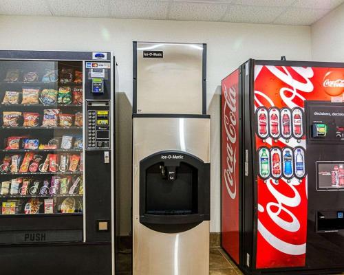 a coca cola vending machine next to a soda machine at Comfort Inn & Suites Lawrence - University Area in Lawrence
