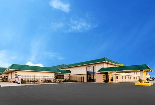 a large building with a parking lot in front of it at Quality Inn & Suites Salina in Salina