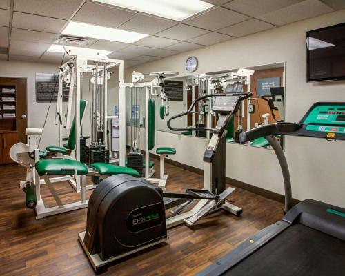 a gym with treadmills and machines in a room at Comfort Suites Georgetown in Georgetown