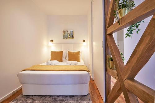 Uma cama ou camas num quarto em Casa Portuguesa Rosa