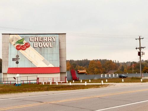 a building with a cherry bowl sign on the side of it at Cedar Ridge Cabins in Honor