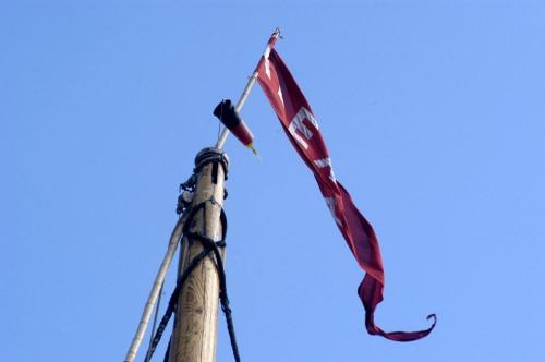 a pole with a flag on top of it at Hotel Admiral Scheer in Laboe