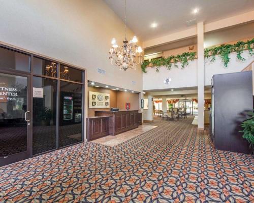 a lobby of a hotel with a waiting area at Comfort Suites London South in London