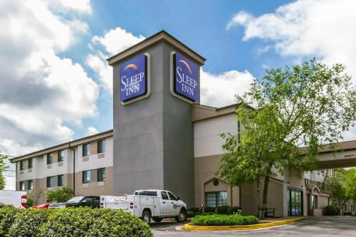 a building with a sign for a ski clinic at Sleep Inn in Lexington