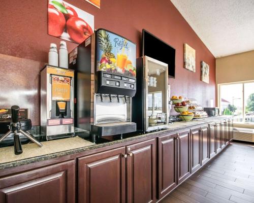 a restaurant kitchen with a counter with aperature at Quality Inn & Suites in Elizabethtown