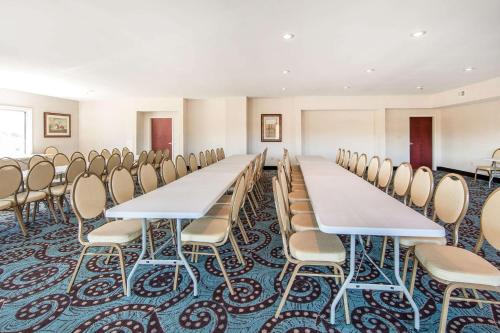 a conference room with rows of tables and chairs at Comfort Inn Lexington South in Nicholasville