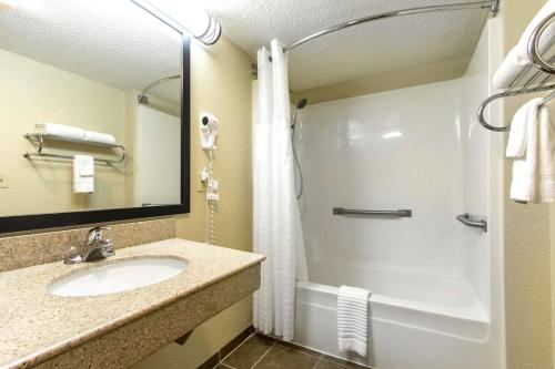 a bathroom with a sink and a shower at Quality Inn in Glasgow