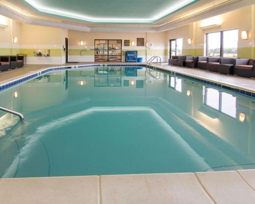 a large swimming pool in a hotel room at Comfort Suites Bossier City - Shreveport East in Bossier City