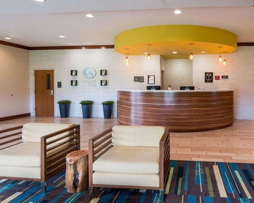 a lobby of a hospital with two chairs and a counter at Comfort Suites Bossier City - Shreveport East in Bossier City