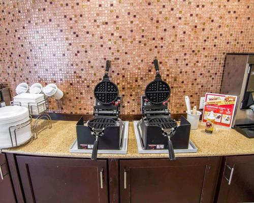 a kitchen counter with two stove tops on top of it at Sleep Inn & Suites I-20 in Shreveport