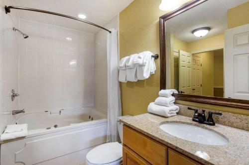 a bathroom with a sink and a tub and a toilet at Bluegreen Vacations Blue Ridge Village, an Ascend Resort in Banner Elk