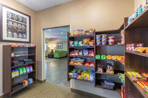 a grocery store aisle with shelves of food at Comfort Inn South Tulsa - Woodland Hills in Tulsa