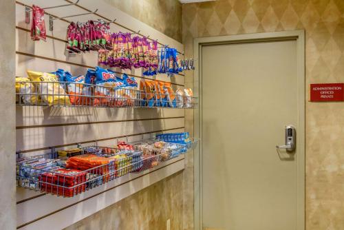 a room with a door and shelves of food at Quality Hotel Conference Center Cincinnati Blue Ash in Blue Ash