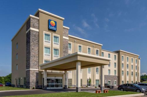 a building with a sign on the front of it at Comfort Inn & Suites - Harrisburg Airport - Hershey South in Middletown