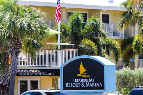 a sign for the treasure ray resort and marina at Treasure Island Hotel and Marina in St Pete Beach