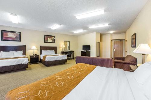 a hotel room with two beds and a couch at Comfort Suites Summit County in Dillon