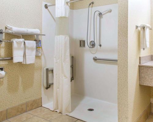 a bathroom with a shower with a shower curtain at Quality Inn & Suites Meriden in Meriden