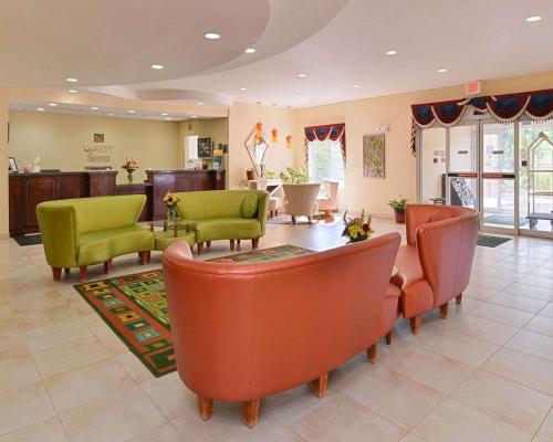 a waiting room with chairs and a table in a hospital at Quality Suites Stratford in Stratford