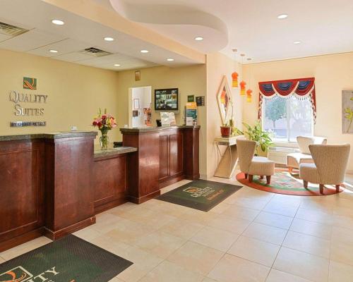 a waiting room at a quality smiles clinic with chairs at Quality Suites Stratford in Stratford
