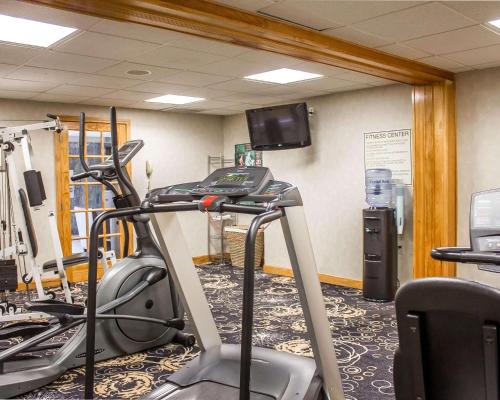 a gym with a treadmill and a tv on a wall at Comfort Inn Wethersfield - Hartford in Wethersfield
