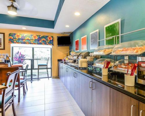 a fast food restaurant with a counter with food at Comfort Suites Tampa - Brandon in Tampa