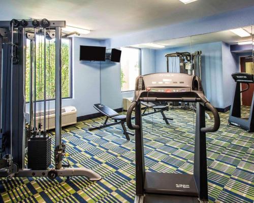a fitness room with a gym with a treadmill at Comfort Inn & Suites Lantana - West Palm Beach South in Lantana