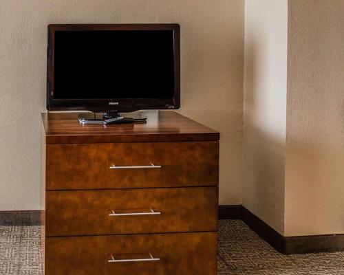 a television sitting on top of a wooden dresser at Comfort Inn & Suites Lakeland North I-4 in Lakeland