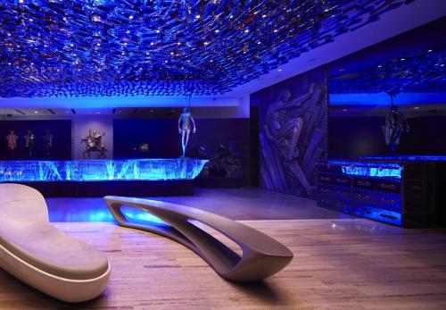 a room with a dance floor with a pair of shoes at Hotel Éclat Beijing in Beijing