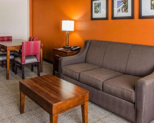 a living room with a couch and a table at Comfort Inn & Suites Lakeland North I-4 in Lakeland