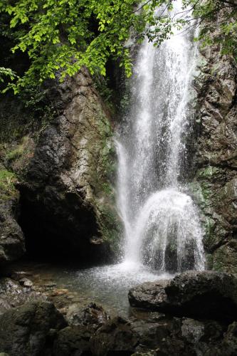 a waterfall in the middle of a river at Villa con bosco giardino e ruscello ad uso esclusivo in Borzonasca