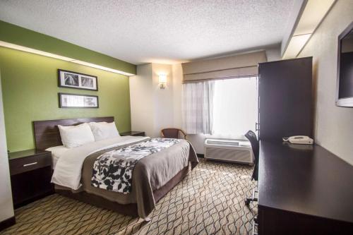 A bed or beds in a room at Sleep Inn Miami Airport