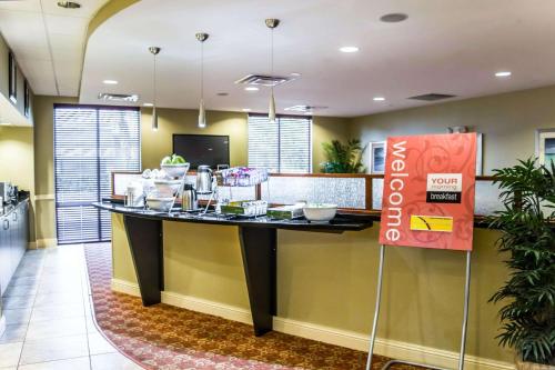 a lobby with a counter with food on it at Comfort Suites Palm Bay - Melbourne in Palm Bay