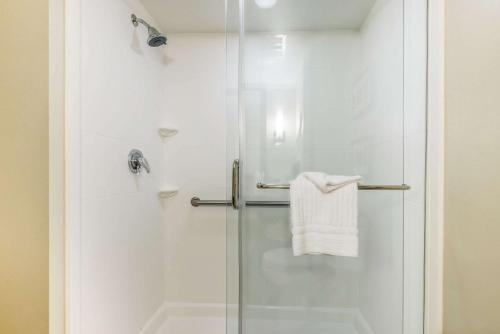 a bathroom with a shower with a glass door at Comfort Suites Dunnellon near Rainbow Springs in Dunnellon