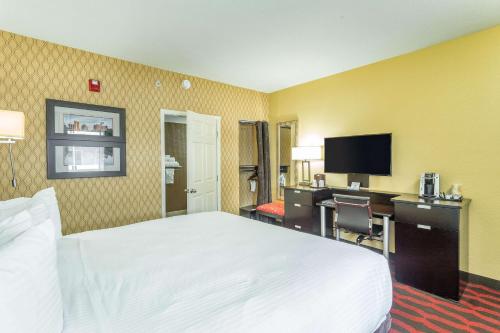 a hotel room with two beds and a television at Inn at the Peachtrees, Ascend Hotel Collection in Atlanta