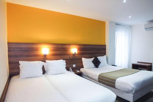 Postel nebo postele na pokoji v ubytování Hotel Cecil Metz Gare