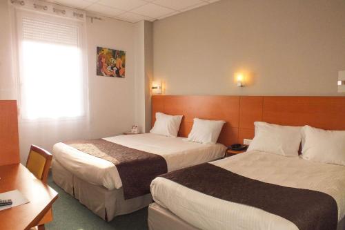 Letto o letti in una camera di Hotel Cecil Metz Gare