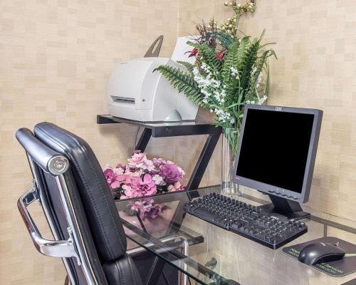 a desk with a computer and a printer at Quality Inn Dahlonega Near University in Dahlonega
