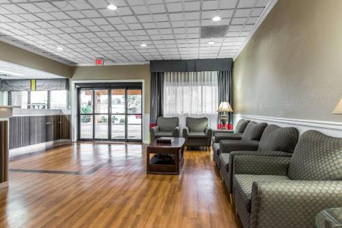 a waiting room with couches and a table at Quality Inn Savannah Midtown in Savannah