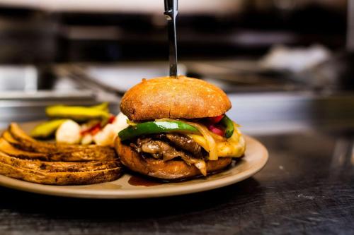 a sandwich on a plate with french fries at The Ridges Resort on Lake Chatuge in Young Harris