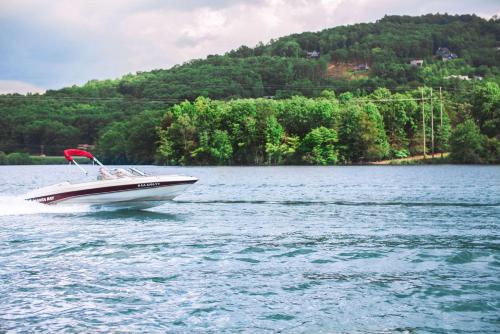 a boat on a large body of water at The Ridges Resort on Lake Chatuge in Young Harris