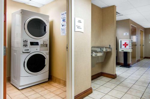 a laundry room with a washer and dryer at Quality Inn & Suites Decatur - Atlanta East in Decatur
