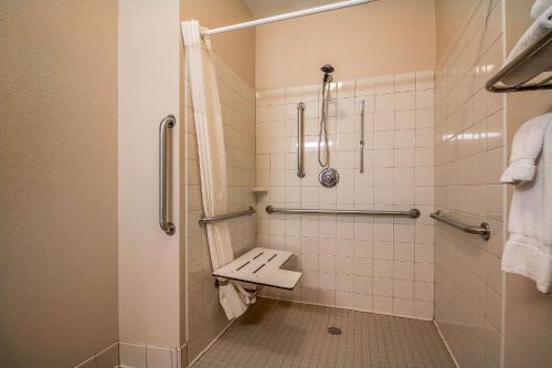 a bathroom with a shower with a toilet in it at Quality Inn Coralville - Iowa River Landing in Coralville