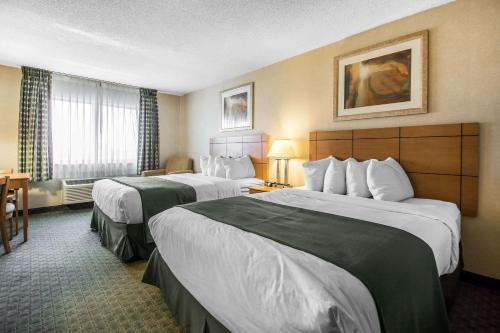 a hotel room with two beds and a window at Quality Inn Dubuque on Hwy 20 in Dubuque