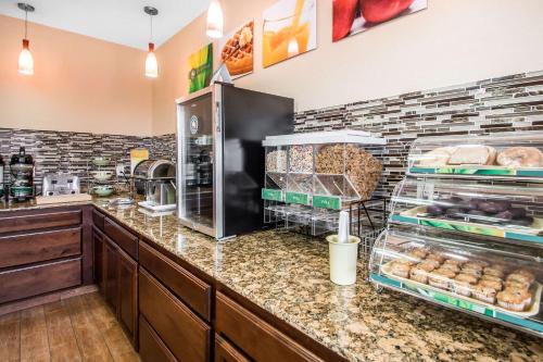 a kitchen with a counter with food on it at Quality Inn Dubuque on Hwy 20 in Dubuque