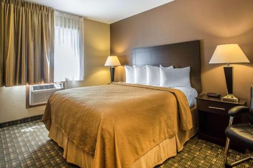a hotel room with a bed and a window at Quality Inn & Suites Decorah in Decorah