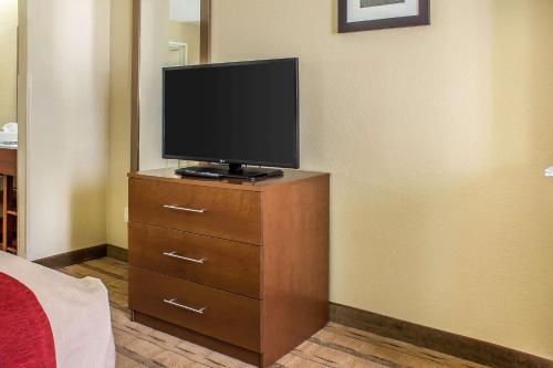 a television sitting on a dresser in a room at Comfort Inn & Suites Cedar Rapids North - Collins Road in Cedar Rapids