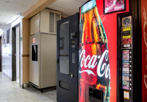 a cocacola vending machine next to a soda machine at Quality Inn Osceola in Osceola